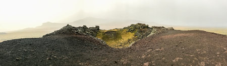 Snaefellsness national park in Iceland panorama from top of volcano during foggy day black and red...