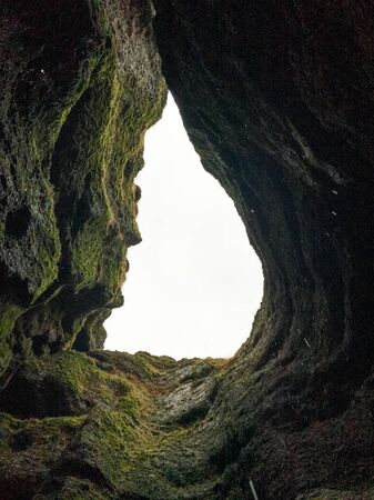 Snaefellsness national park in Iceland Raudfeldsgja gorge upwards view from inside crack water dripping downの写真素材