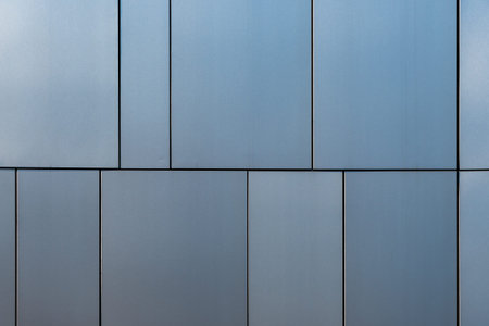 Stainless steel facade cladding shining in different grey and blue tones building elements