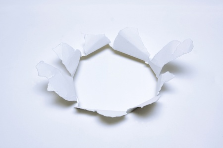 Breaking paper with holeの写真素材