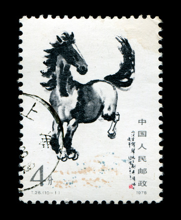 Postage stamp printed running horseの写真素材
