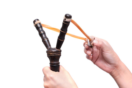 Hand Holding Aiming Slingshotの写真素材