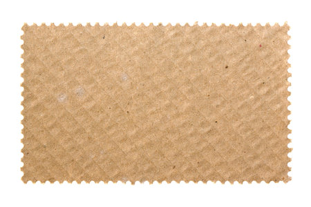 Blank postage stamp with cardboard background