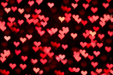 Floating red and pink bokeh heartsの写真素材