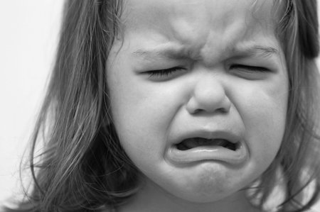 Baby girl crying in black and white