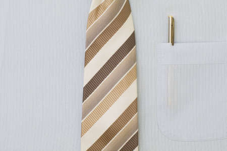 Freshly ironed shirt with pen in pocket and tieの写真素材