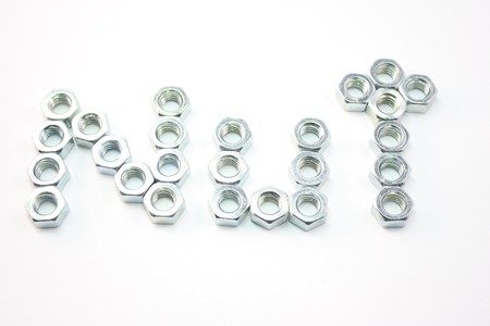 Nuts spelling out the word NUT on an isolated white background.の写真素材