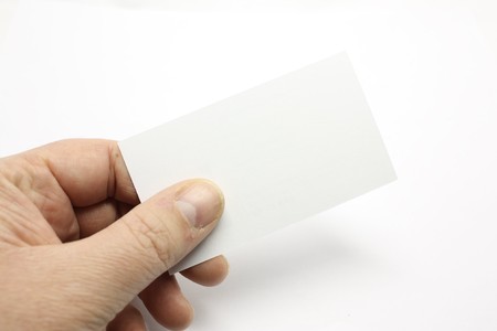 Handing out a business card, a blank one for your logo.の写真素材