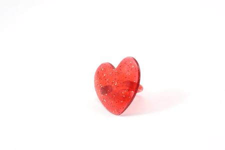 A childs heart shaped ring on a white background.の写真素材