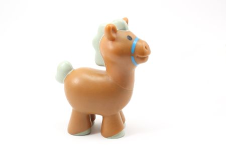 Toy brown horse on a white background.の写真素材