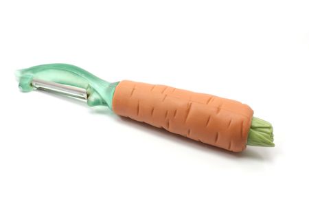 A vegetable peeler shaped like a carrot on a white background.の写真素材