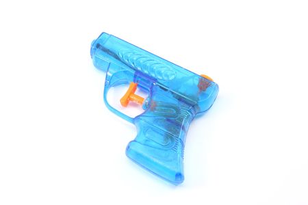 Blue plastic toy squirt gun photographed on a white backgroundの写真素材