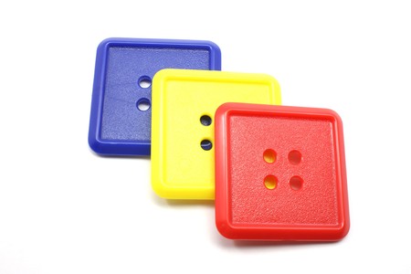Blue Yellow and Red Square Buttons on a white background.の写真素材