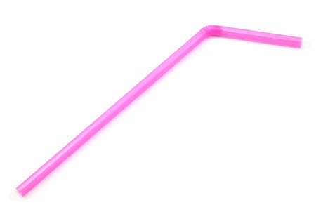 A pink bendy straw on a white background.の写真素材