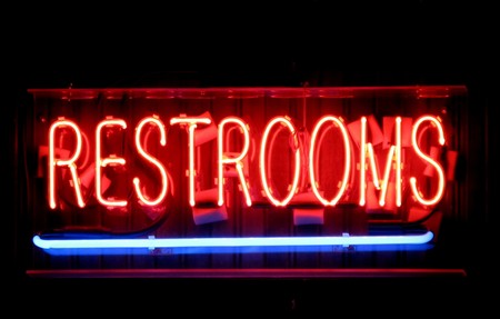 A red and blue restrooms neon sign.の写真素材