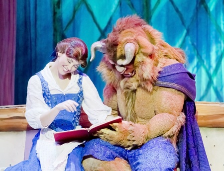 GREEN BAY, WI - FEBRUARY 10: Belle and Beast from Beauty and the Beast read a book at the Disney Princesses show at the Resch Center on February 10, 2012 in Green Bay, Wisconsin.のeditorial素材