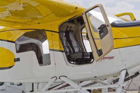 OSHKOSH, WI - JULY 27: An Expedition 350 Sea Plane close up with the door open in yellow and white with pontoons at the 2012 AirVenture at EAA on July 27, 2012 in Oshkosh, Wisconsin.のeditorial素材