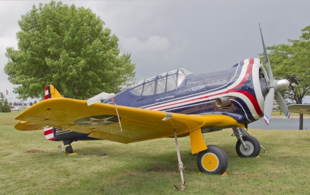 OSHKOSH, WI - JULY 27: A World War 2 P64 Fighter plane in red, white, and blue piloted by Paul Poberezny on display at the 2012 AirVenture at EAA on July 27, 2012 in Oshkosh, Wisconsin.のeditorial素材