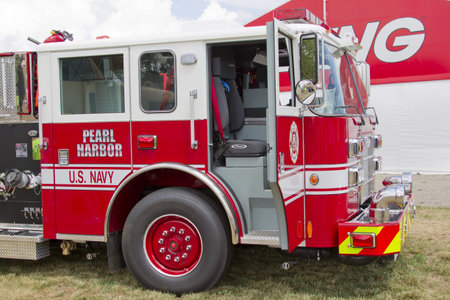 OSHKOSH, WI - JULY 27:  Side view of a Pierce red & white Fire Truck marked US Navy Pearl Harbor on...