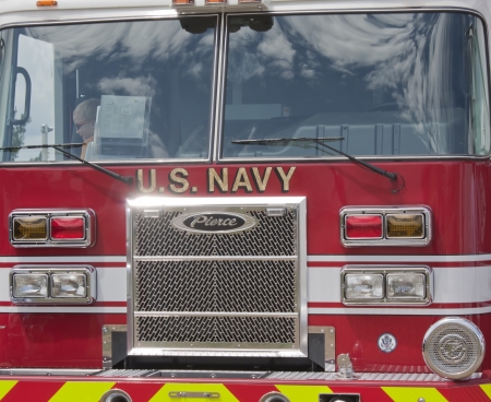 OSHKOSH, WI - JULY 27:  Front Close up of a Pierce red & white Fire Truck marked US Navy Pearl Harbor on display the 2012 AirVenture at EAA on July 27, 2012 in Oshkosh, Wisconsin.のeditorial素材