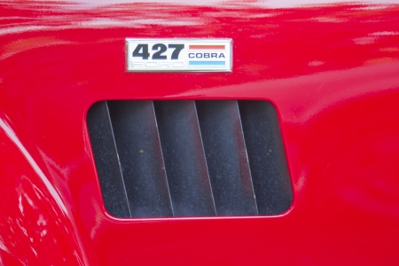 WAUPACA, WI - AUGUST 25: Emblem of 1965 Red White Ford AC Cobra car at the 10th Annual Waupaca Rod & Classic Car Club Car Show on August 25, 2012 in Waupaca, Wisconsin.のeditorial素材