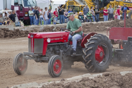 DE PERE, WI - AUGUST 18: Massey Ferguson Tractor competing at the Tractor Pull event at the Brown County Fair on August 18, 2012 in De Pere, Wisconsin.のeditorial素材