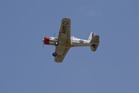 OSHKOSH, WI - JULY 27: Flying by us WWII U.S. Army Fighter Plane flying on display at the 2012 AirVenture at EAA on July 27, 2012 in Oshkosh, Wisconsin.のeditorial素材
