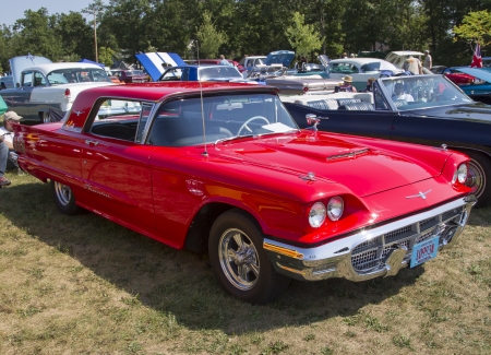 WAUPACA, WI - AUGUST 24:  Side of 1960 Red Ford Thunderbird Car at Waupaca Rod and Classic Annual Car Show August 24, 2013 in Waupaca, Wisconsin.のeditorial素材