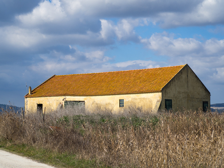 Farm house near mountain under blue skyの写真素材