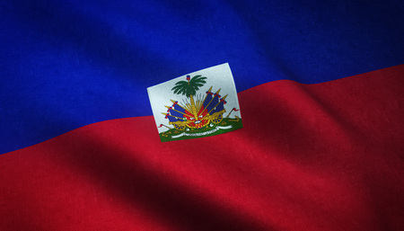 Realistic flag of Haiti waving with highly detailed fabric texture.の写真素材