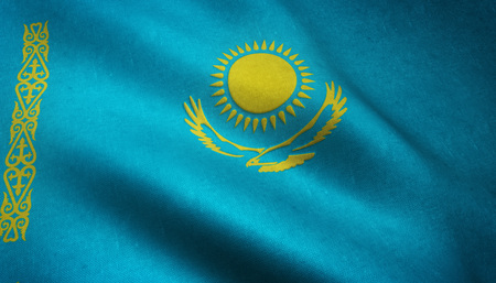Realistic flag of Kazakhstan waving with highly detailed fabric texture.の写真素材