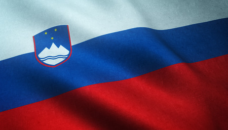 Realistic flag of Slovenia waving with highly detailed fabric texture.の写真素材