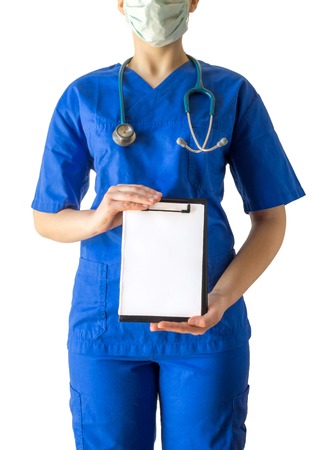Young female doctor in blue medical uniform holding empty blank clipboard sign with copy space for text. Caucasian female model isolated over white background.の写真素材