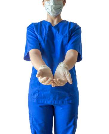 Young female doctor in blue medical showing open hands with sterilized surgical gloves. Caucasian female model isolated over white background.の写真素材