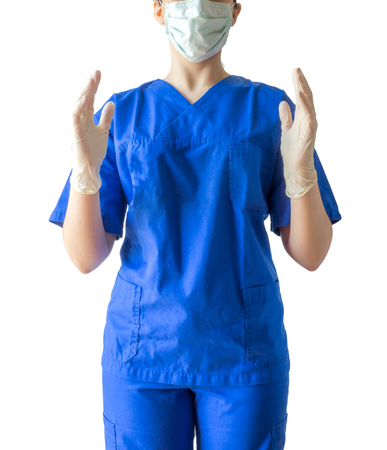 Unknown young female doctor in blue medical uniform with mask and sterilized surgical glove. Caucasian female model isolated over white background.の写真素材