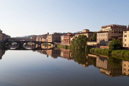 view on bridge Ponte Vecchio on arno river in florence in italy with reflectionのeditorial素材