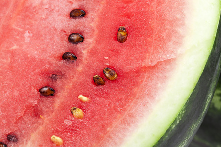 half a fresh red watermelon close upの写真素材