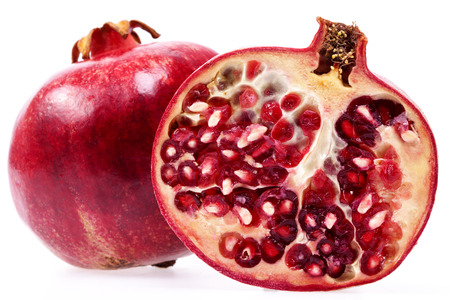 some fruits of red pomegranate isolated on white background, close up.の写真素材