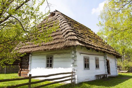 old traditional wooden polish cottage in open-air museum, Ethnographic Park, Kolbuszowa, Polandのeditorial素材
