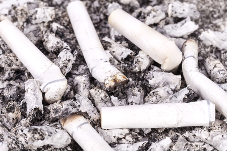 cigarette butts and ash, close up.の写真素材
