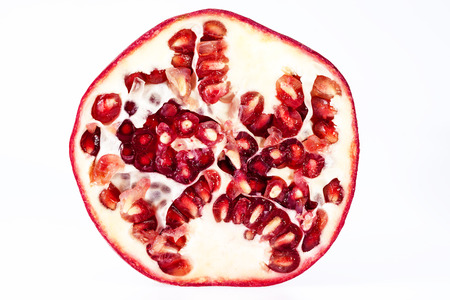 Fruit of red pomegranate isolated on white background, close up.の写真素材