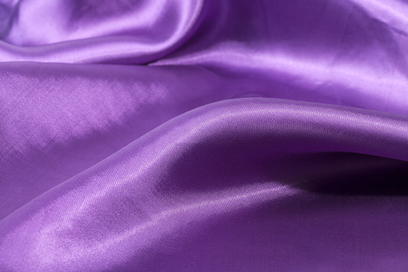Silk background, texture of violet shiny fabric, close upの写真素材
