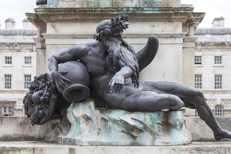 Neoclassical Somerset House in the district Covent Garden, King George III statue on courtyard, pedestal sculpture, London, United Kingdomのeditorial素材