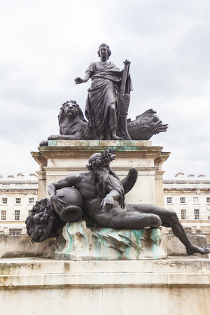 Neoclassical Somerset House in the district Covent Garden, King George III statue on courtyard, London, United Kingdomのeditorial素材