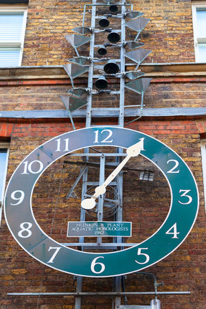 LONDON, UNITED KINGDOM - JUNE 22, 2017: Water clock on the facade of the building, Neal's Yard. It...