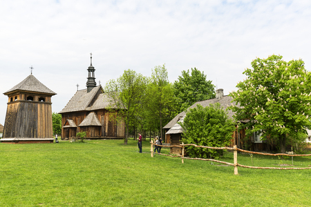 TOKARNIA, POLAND - MAY 2, 2018: 18th century wooden church in open air museum, Museum of the Kielce Village ( Muzeum Wsi Kieleckiej),  rural landscapeのeditorial素材