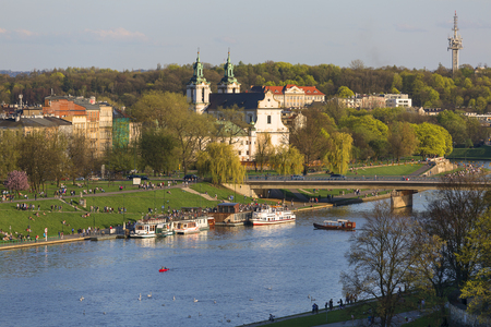 KRAKOW, POLAND - APRIL 14, 2018: Boulevards on the river Wisla, recreational area for residents and tourists, a lot of peopleのeditorial素材