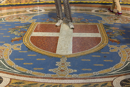 MILAN, ITALY - SEPTEMBER 28, 2018: Gallery Vittorio Emanuele II, luxury shopping mall. Decorative floor. It was designed and built by architect Giuseppe Mengoni between 1865 and 1867のeditorial素材