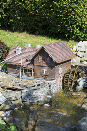 INWALD, POLAND - AUGUST 12, 2018 : Miniature Park "Dream world", small replica of rural landscape, wooden watermill, Podlasie village, in 1:25 scaleのeditorial素材