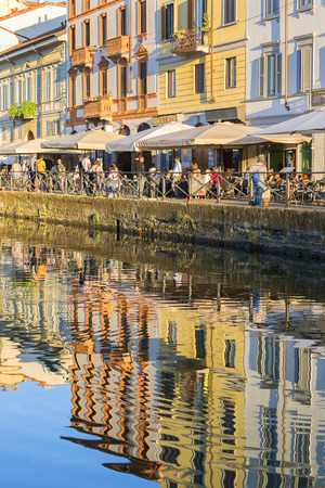 MILAN, ITALY - SEPTEMBER 28, 2018: Naviglio Grande, water channel in the city center, popular meeting place, reflection in the waterのeditorial素材